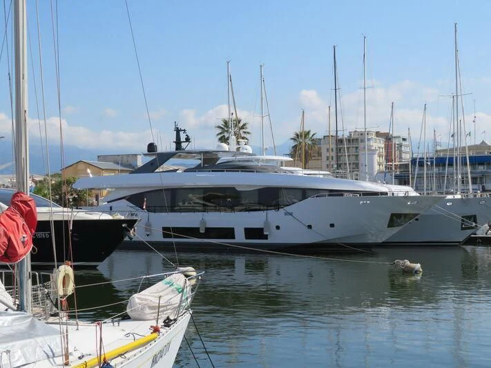 a boat docked at a pier aboard FOUR JOYS Yacht for Sale