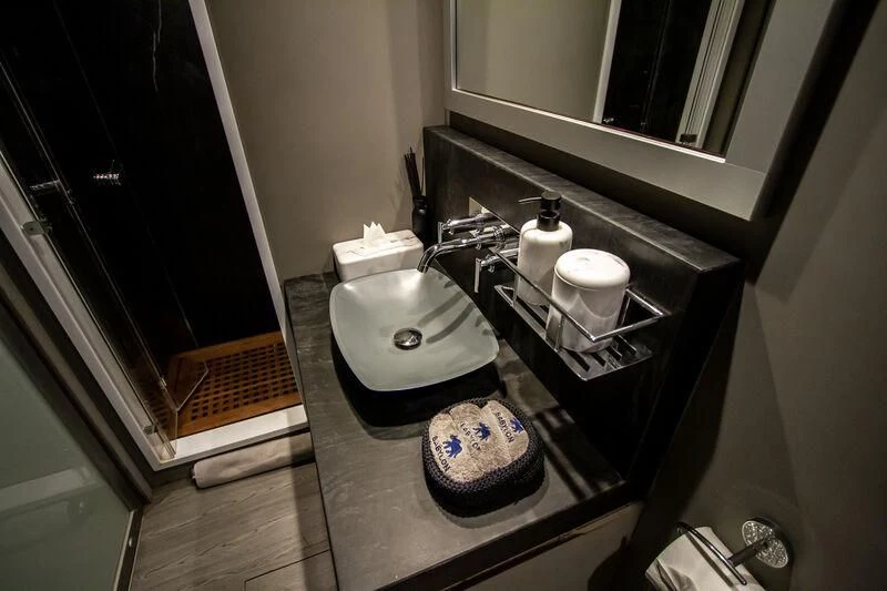 a bathroom with a sink and a mirror aboard BABYLON Yacht for Sale
