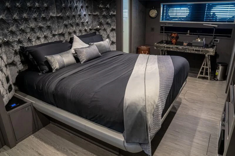 a bed in a room aboard BABYLON Yacht for Sale