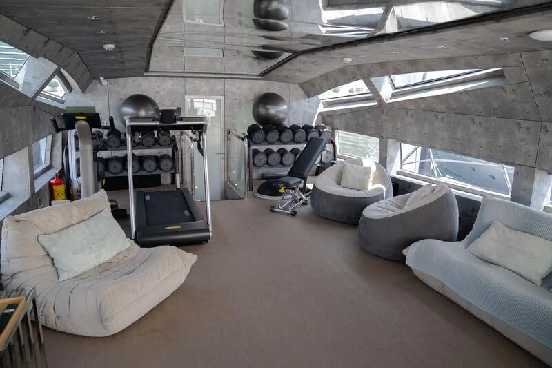 a room with a couch and a computer aboard BABYLON Yacht for Sale