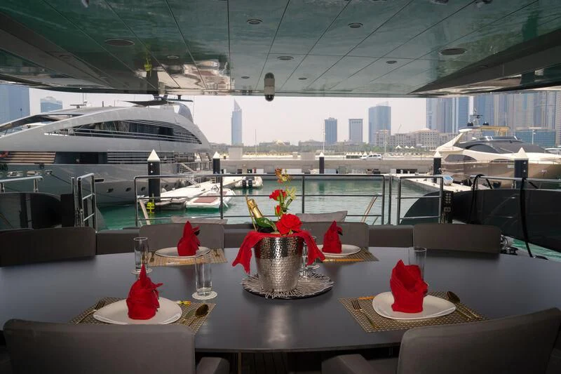 a table with food and drinks on it aboard BABYLON Yacht for Sale