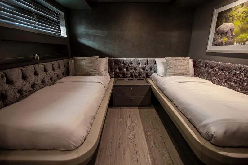 a room with two beds aboard BABYLON Yacht for Sale