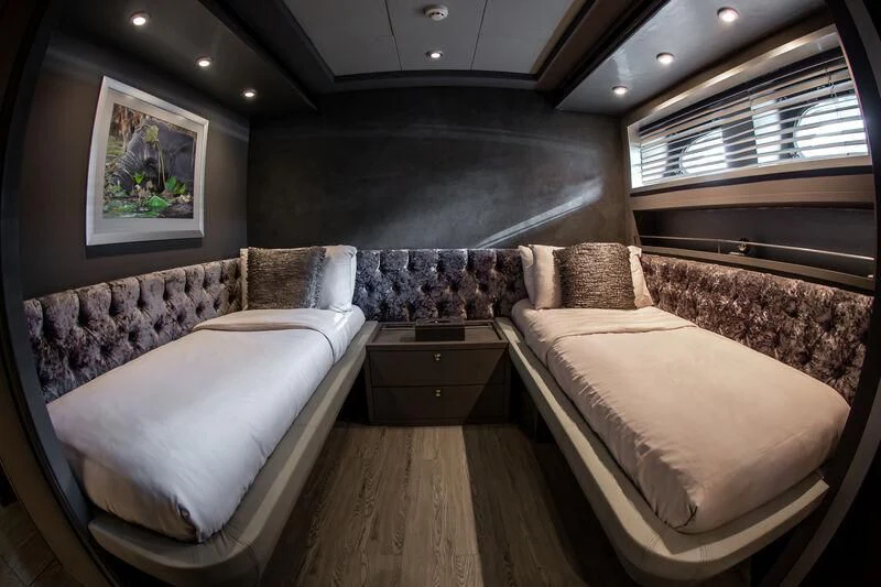 a room with two beds aboard BABYLON Yacht for Sale