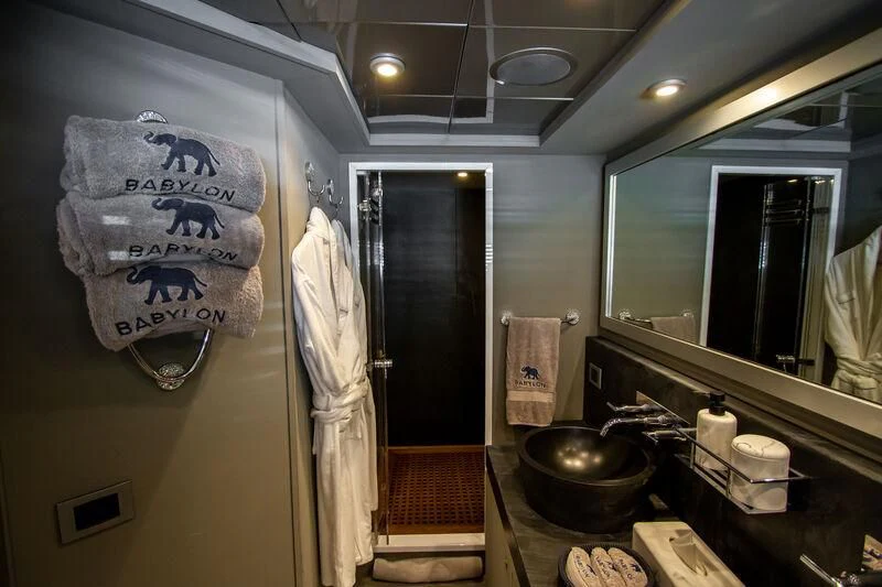 a bathroom with a sink and a mirror aboard BABYLON Yacht for Sale