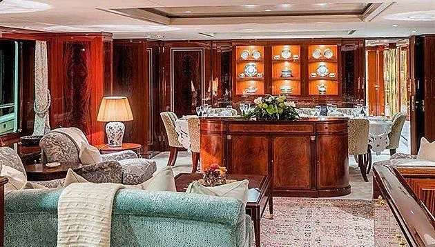 a living room with a piano aboard LA FAMILIA Yacht for Sale