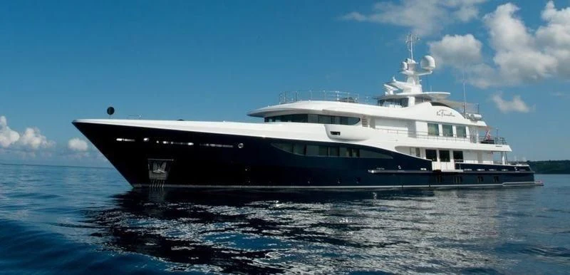 a large boat in the water aboard LA FAMILIA Yacht for Sale