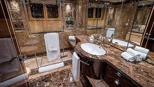 a bathroom with a sink and a shower aboard LA FAMILIA Yacht for Sale