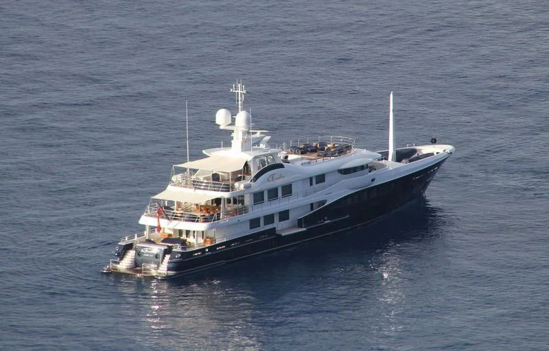 a large ship in the water aboard LA FAMILIA Yacht for Sale