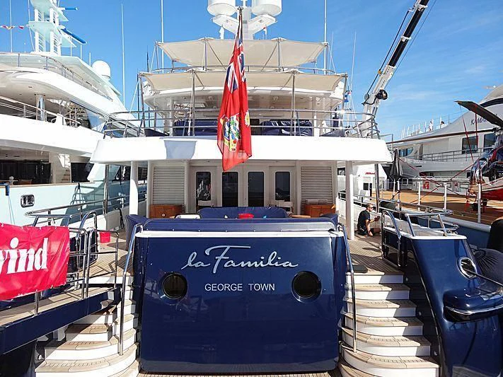 a boat with a flag on the front aboard LA FAMILIA Yacht for Sale