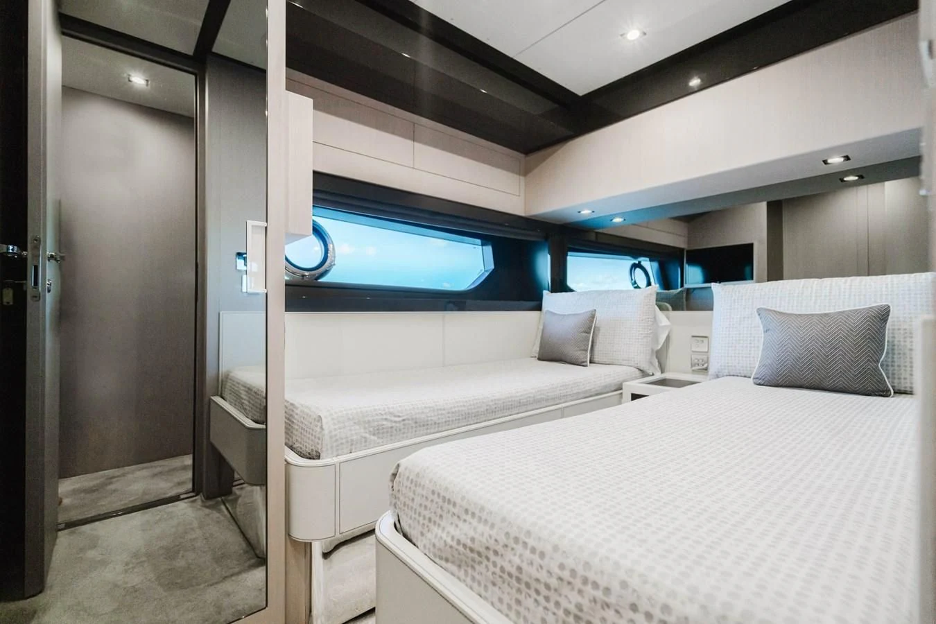 a room with a bed and a television aboard BABY PEARL Yacht for Sale