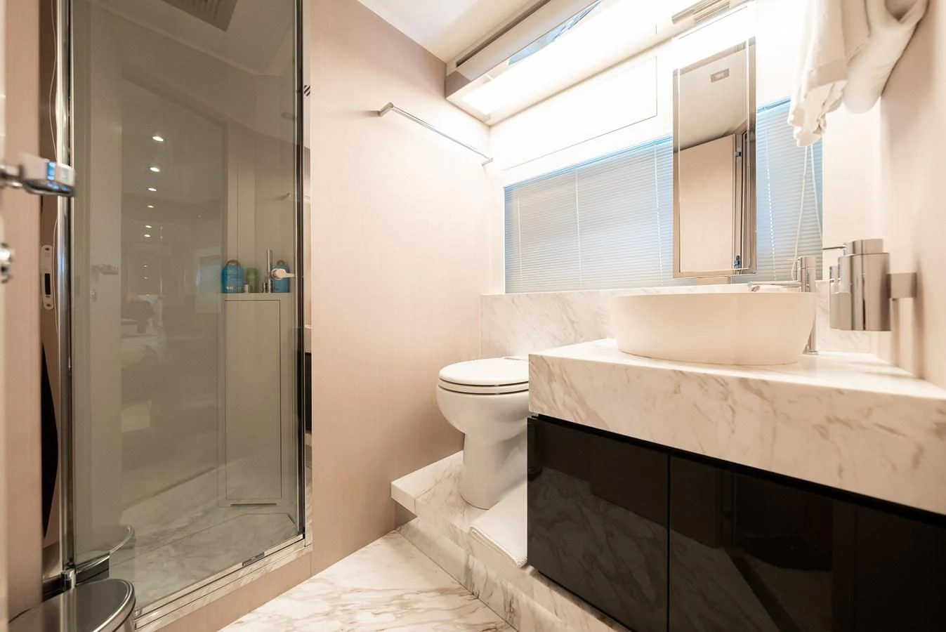 a bathroom with a glass shower aboard BABY PEARL Yacht for Sale