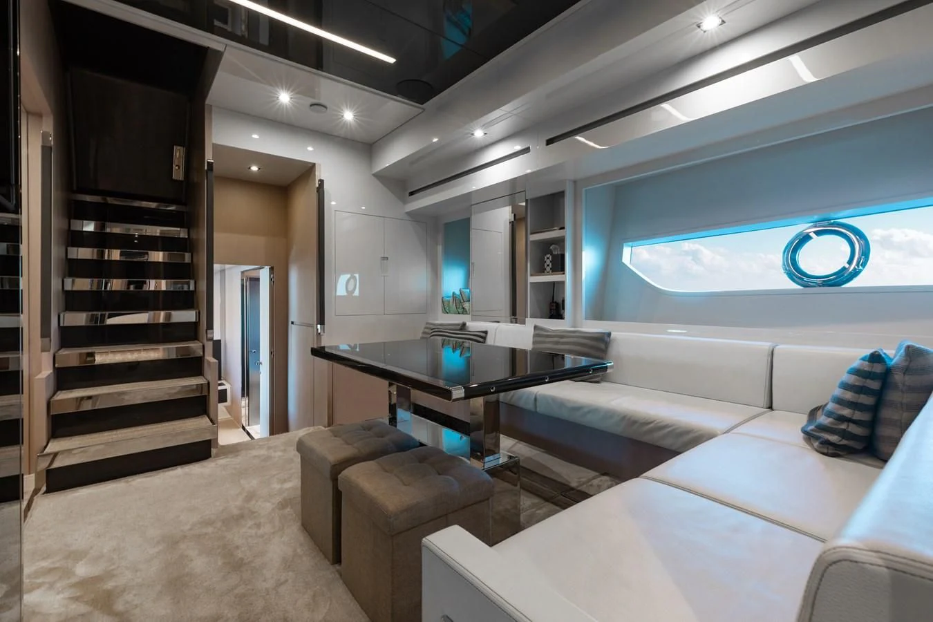 a room with a table and couch aboard BABY PEARL Yacht for Sale