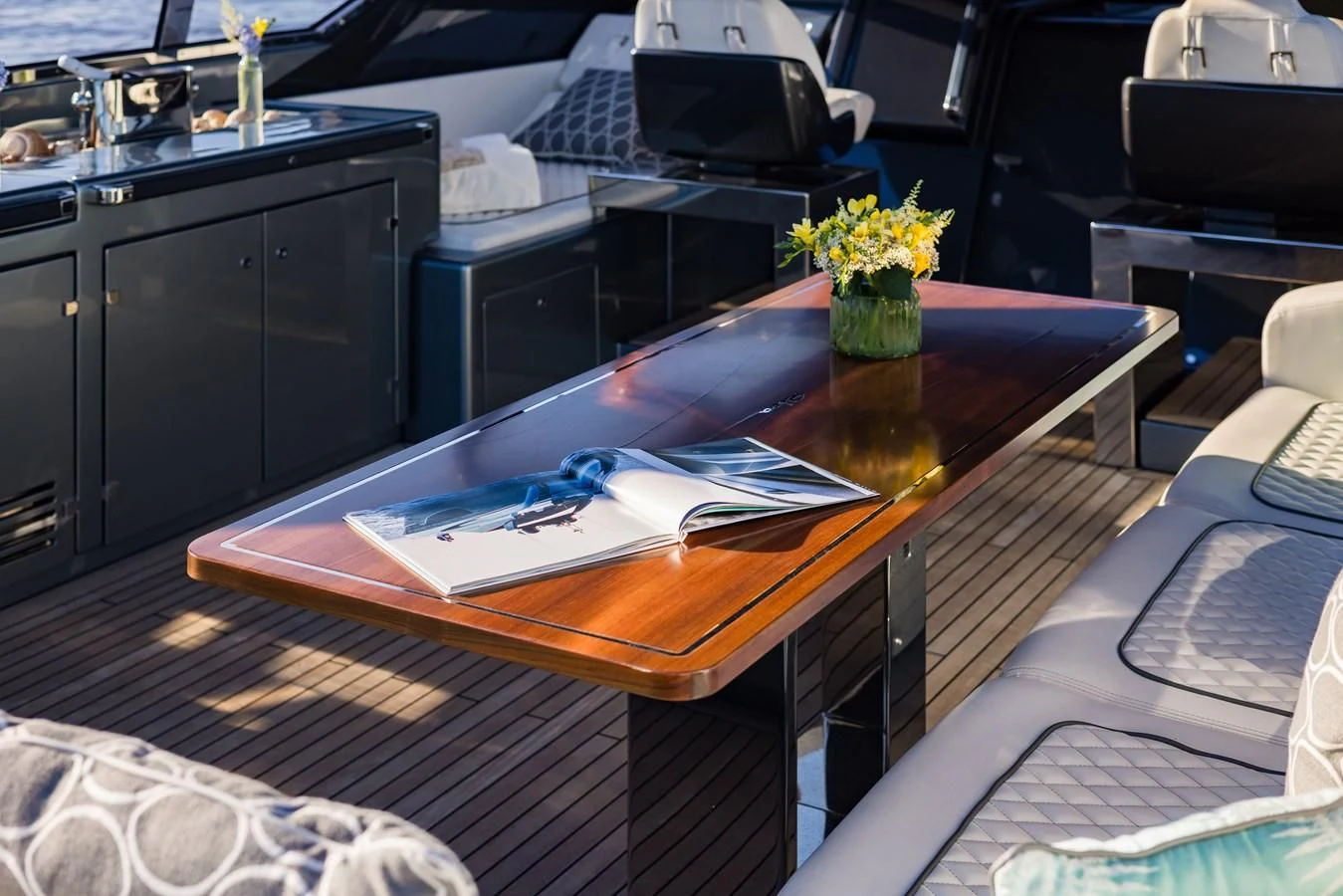 a table with a laptop on it aboard BABY PEARL Yacht for Sale