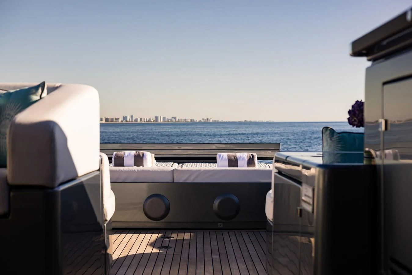 a deck with a view of a city and water aboard BABY PEARL Yacht for Sale