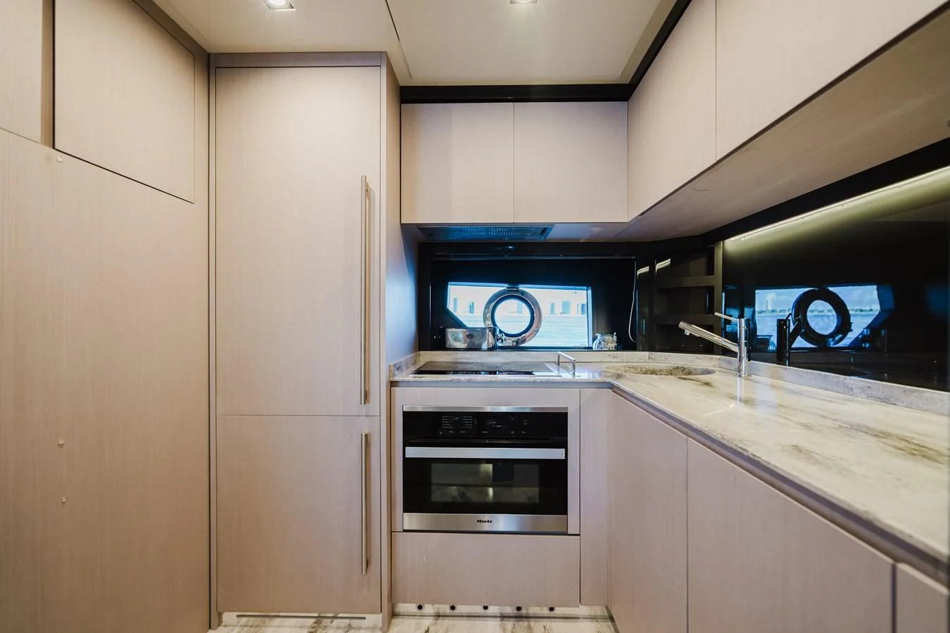 a kitchen with a stove and oven aboard BABY PEARL Yacht for Sale