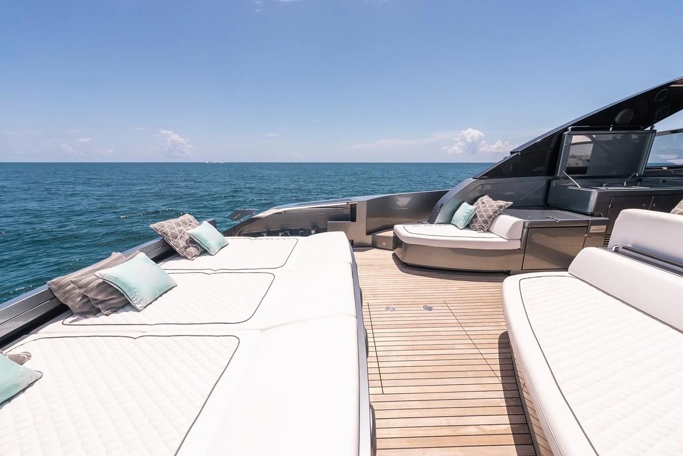 a deck with a view of the ocean and the ocean aboard BABY PEARL Yacht for Sale