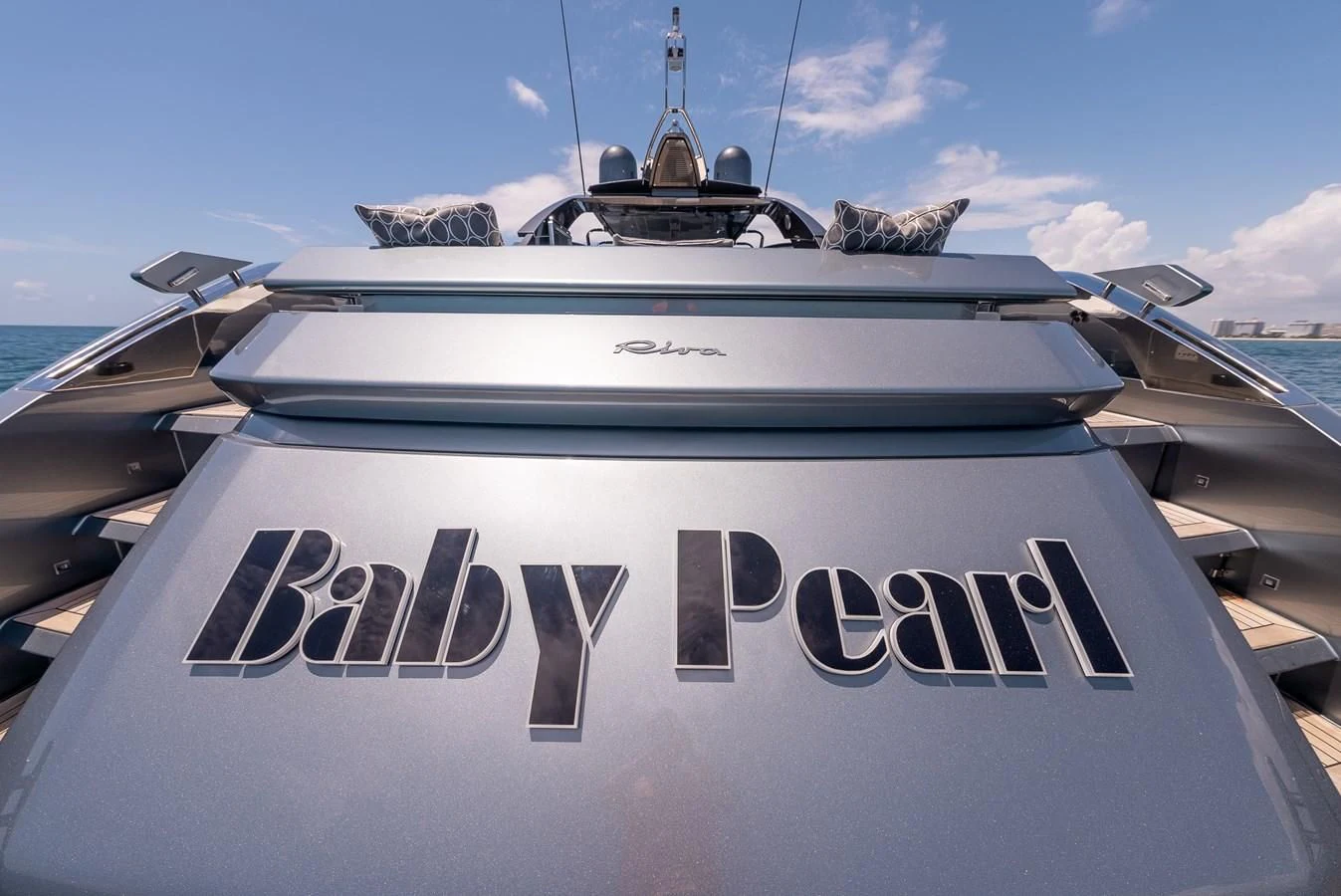 a white yacht with a sign on the front aboard BABY PEARL Yacht for Sale