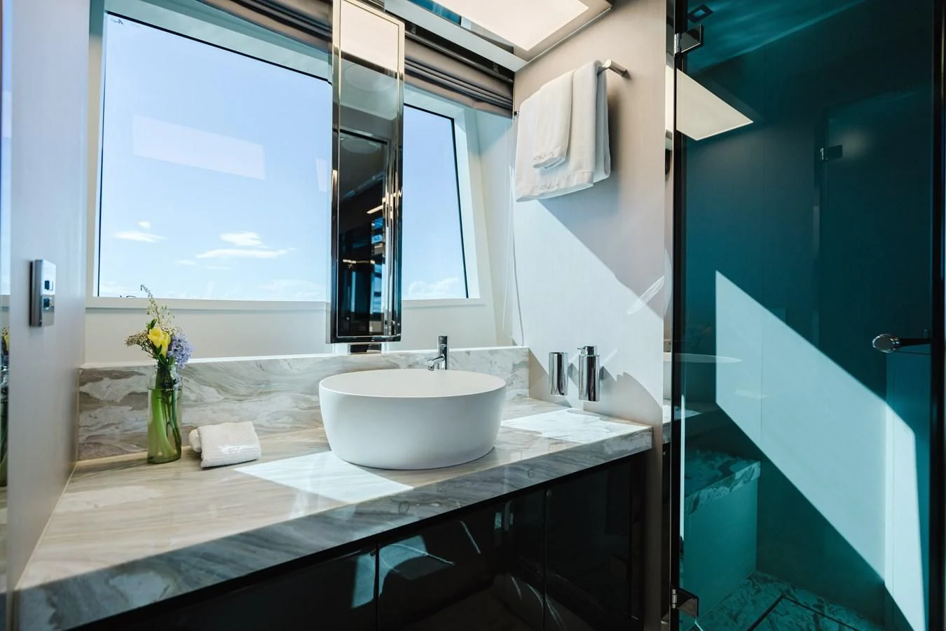 a bathroom with a sink and a mirror aboard BABY PEARL Yacht for Sale