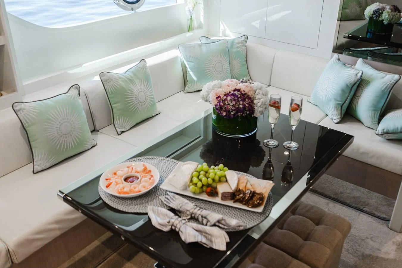 a table with food and drinks aboard BABY PEARL Yacht for Sale