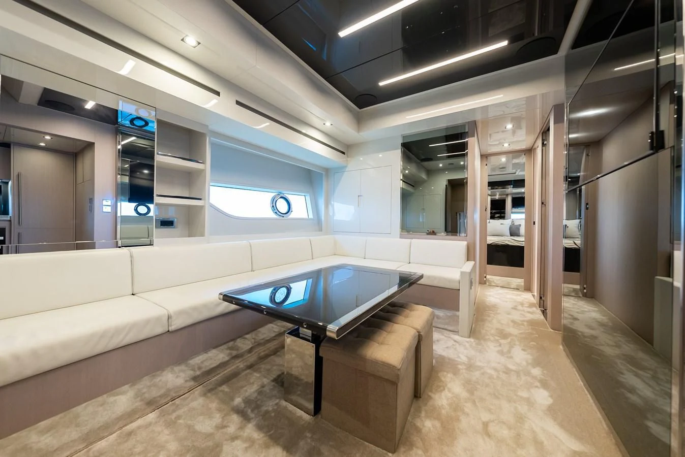 a room with a table and a couch aboard BABY PEARL Yacht for Sale