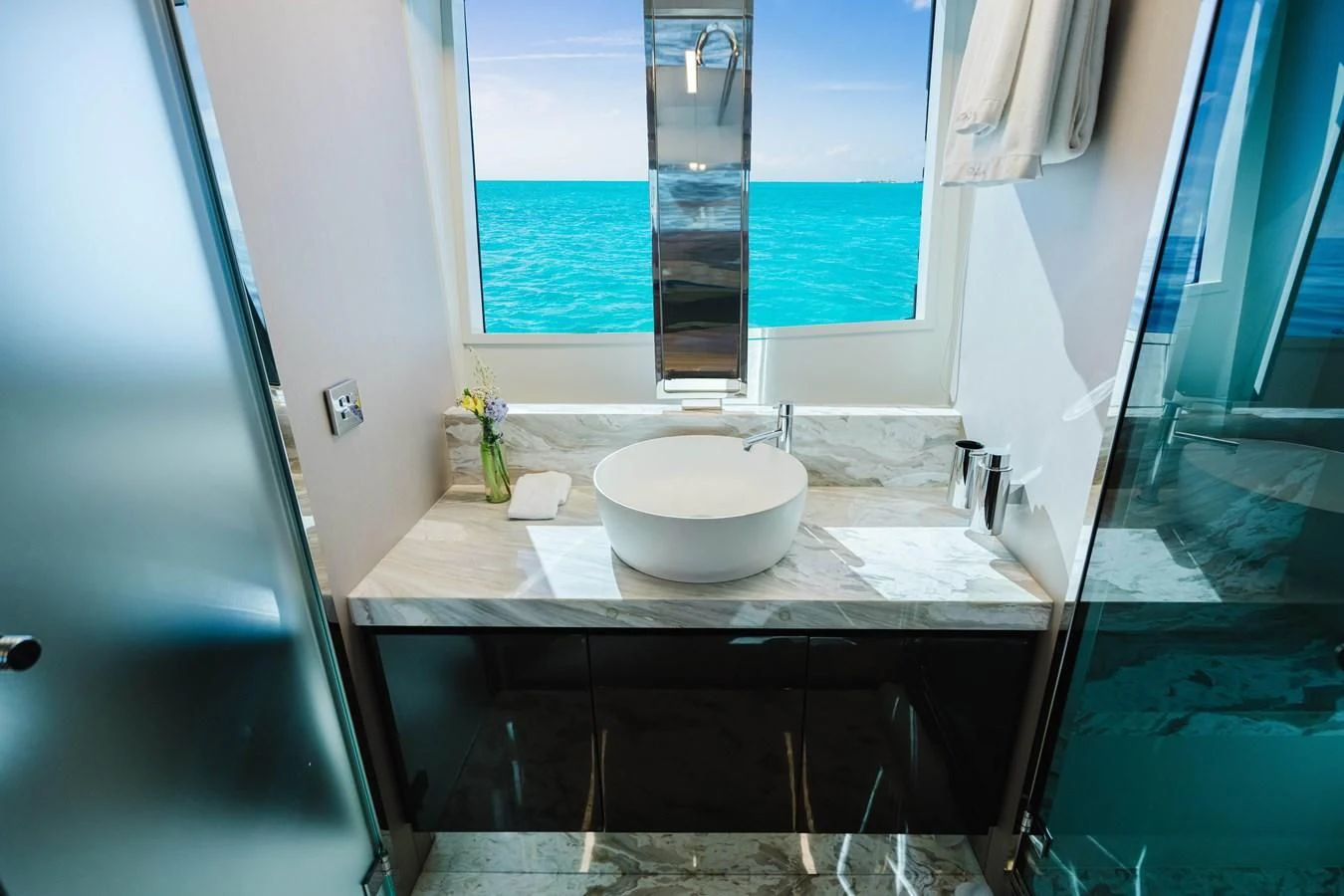 a bathroom with a sink and a window aboard BABY PEARL Yacht for Sale