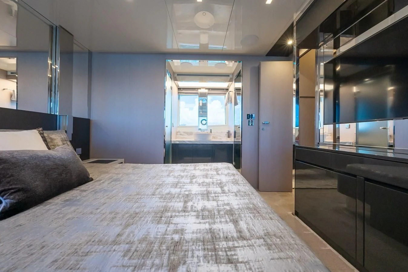 a large room with a bed and a desk aboard BABY PEARL Yacht for Sale