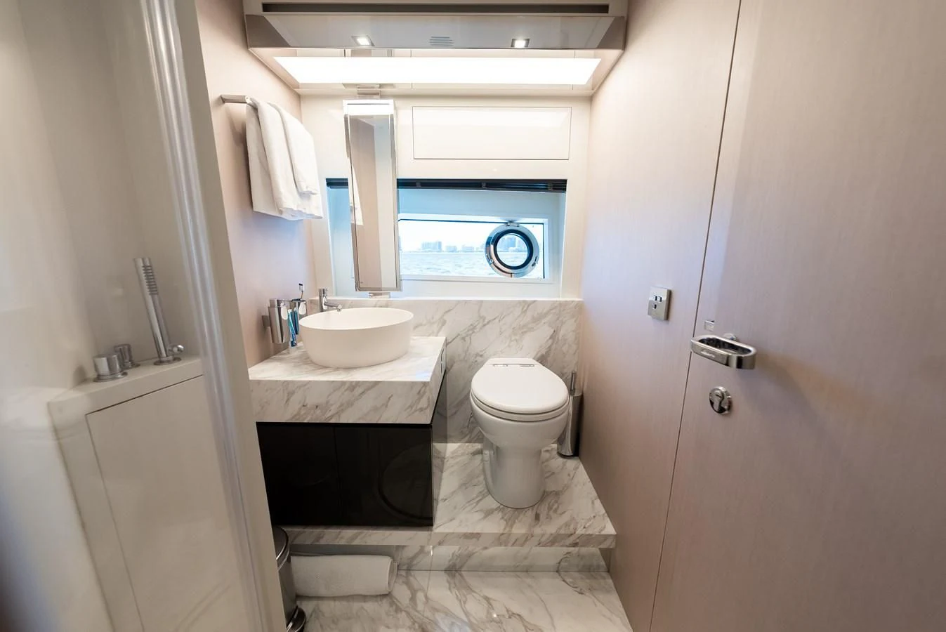 a bathroom with a toilet and sink aboard BABY PEARL Yacht for Sale