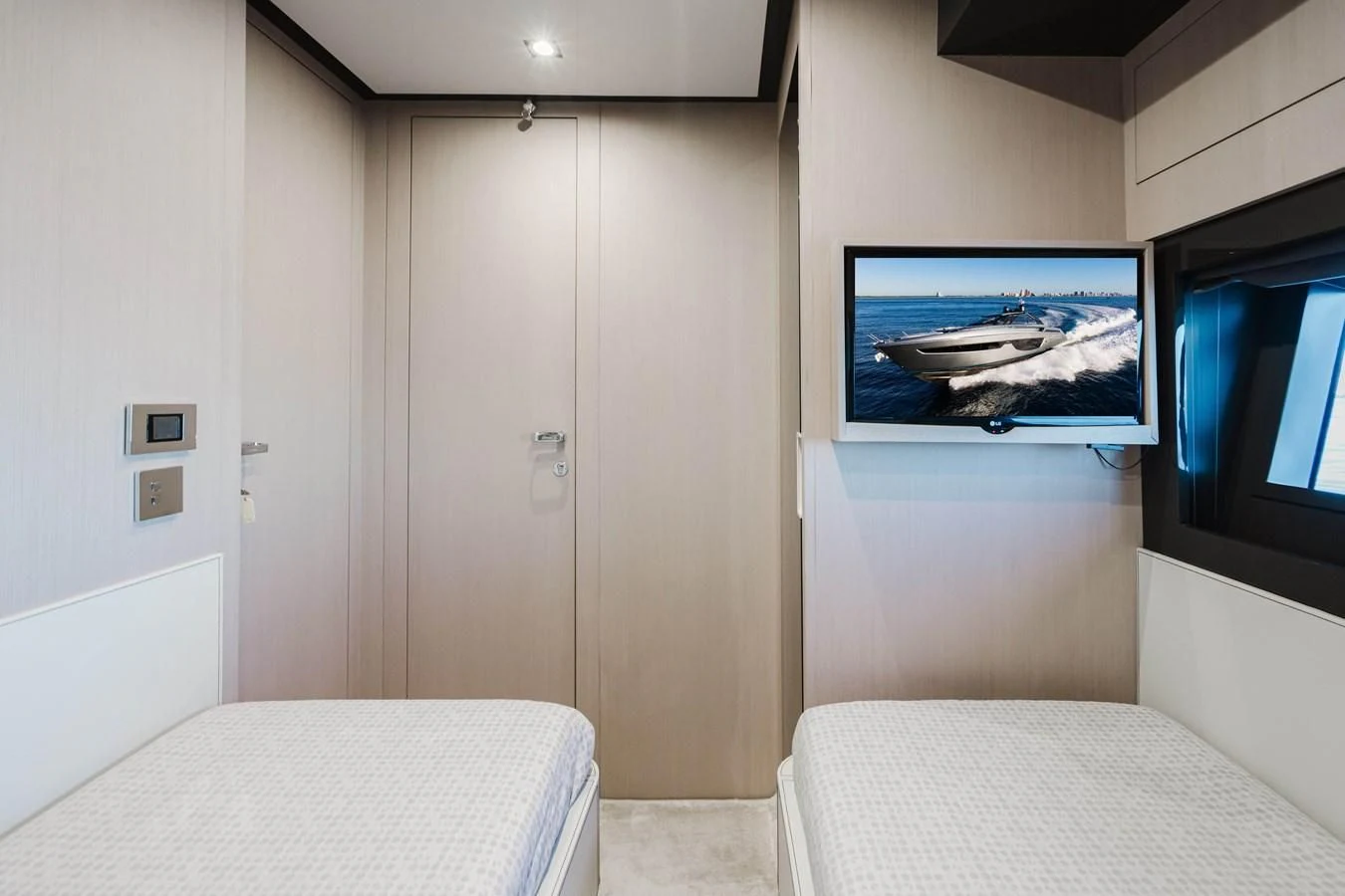 a room with a bed and a television aboard BABY PEARL Yacht for Sale