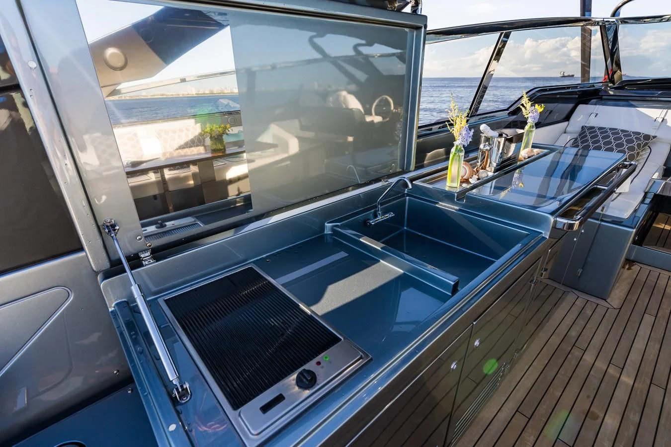 a kitchen with a large glass window aboard BABY PEARL Yacht for Sale