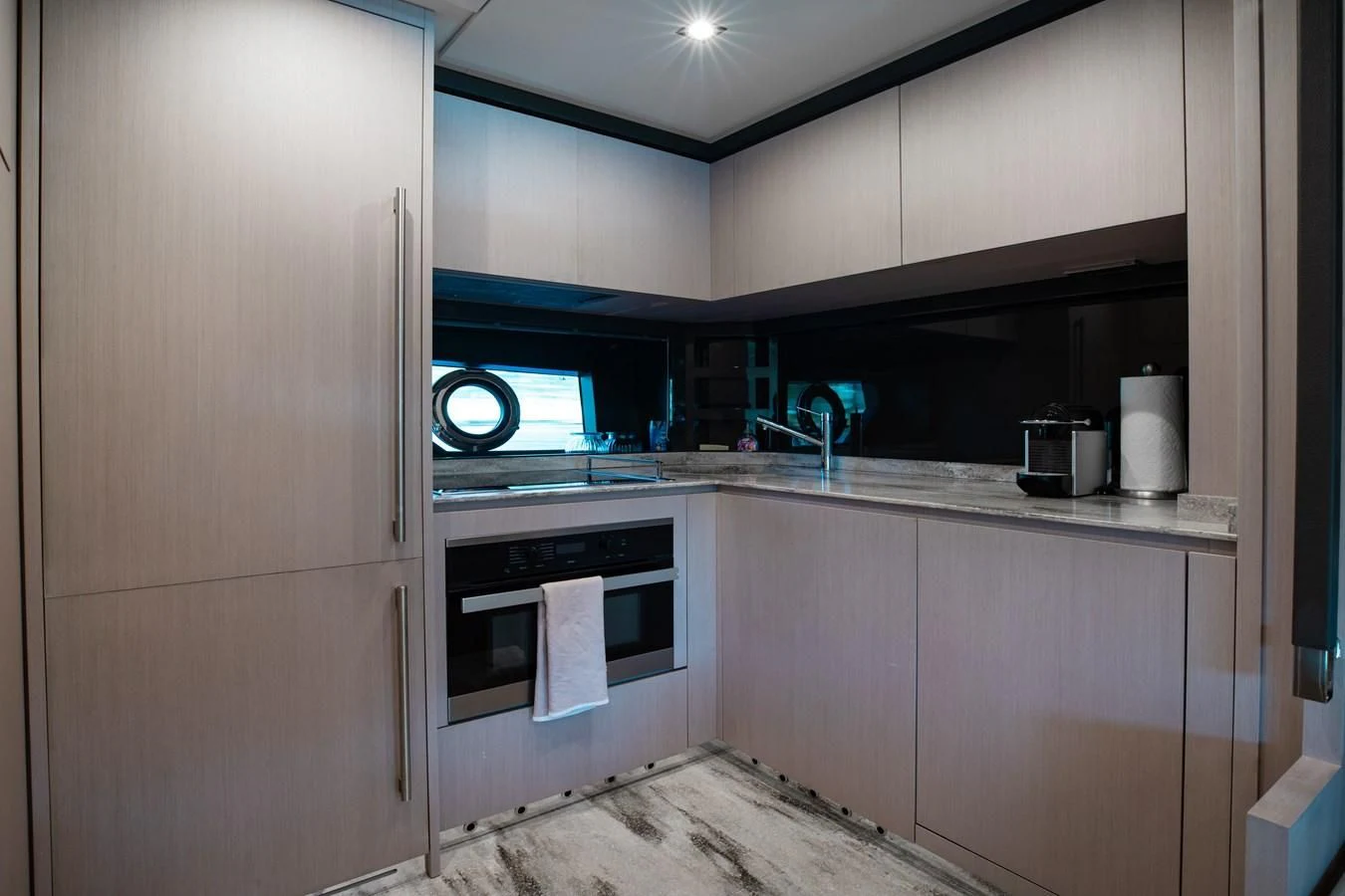 a kitchen with a sink and a microwave aboard BABY PEARL Yacht for Sale