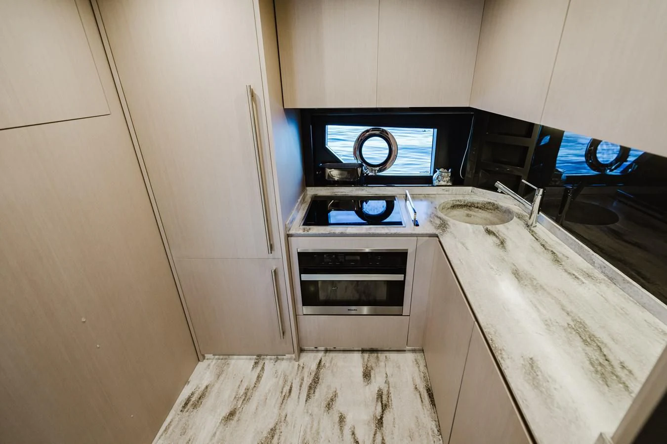 a kitchen with a stove and oven aboard BABY PEARL Yacht for Sale