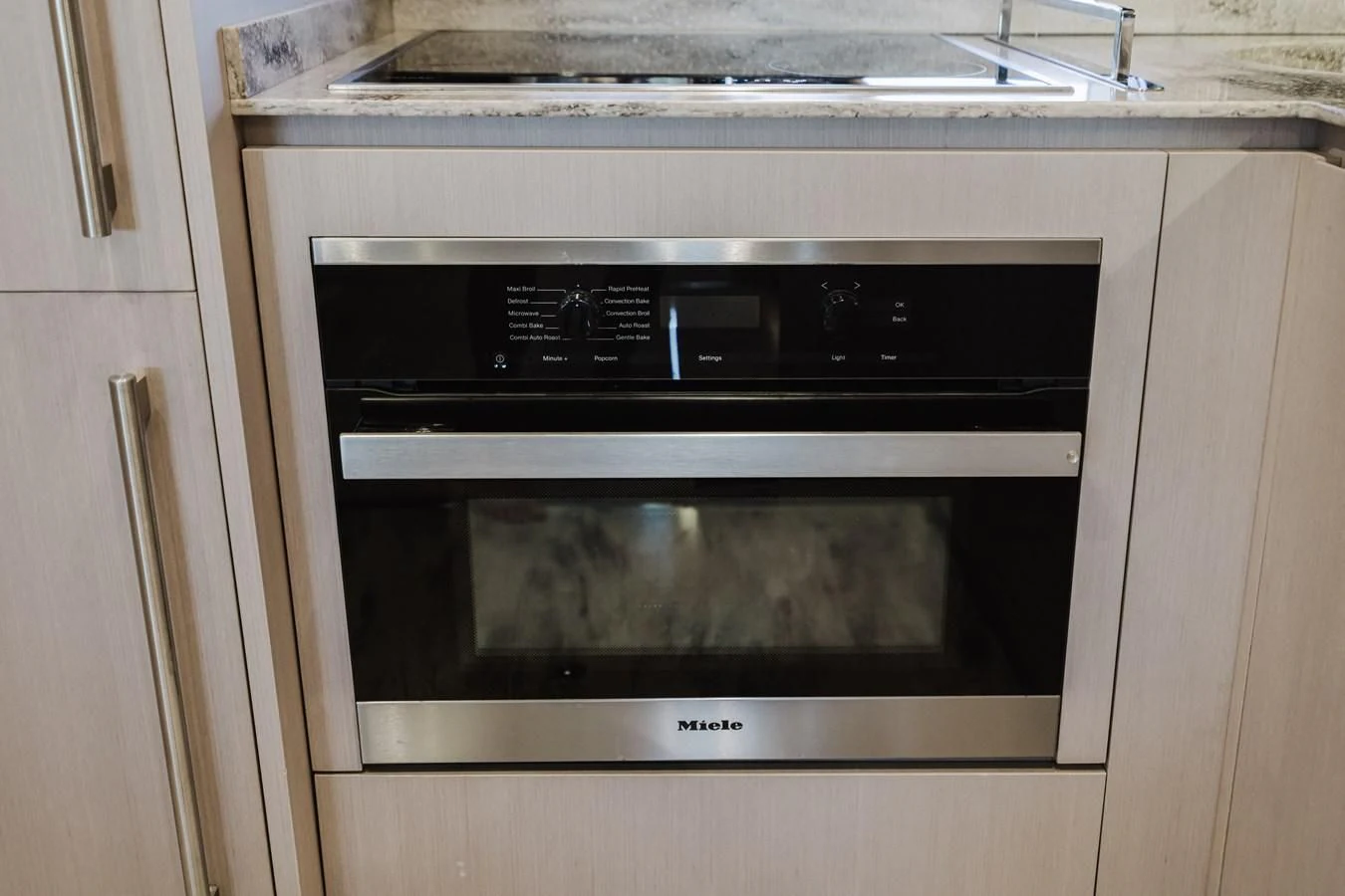 a white oven with a black stove aboard BABY PEARL Yacht for Sale