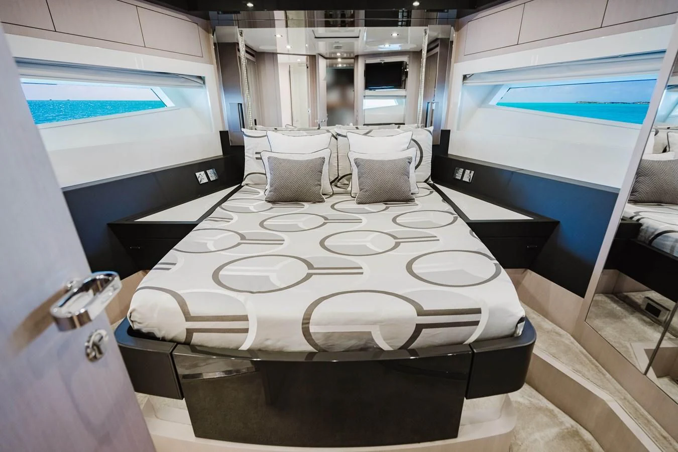 a room with a bed and a chair aboard BABY PEARL Yacht for Sale