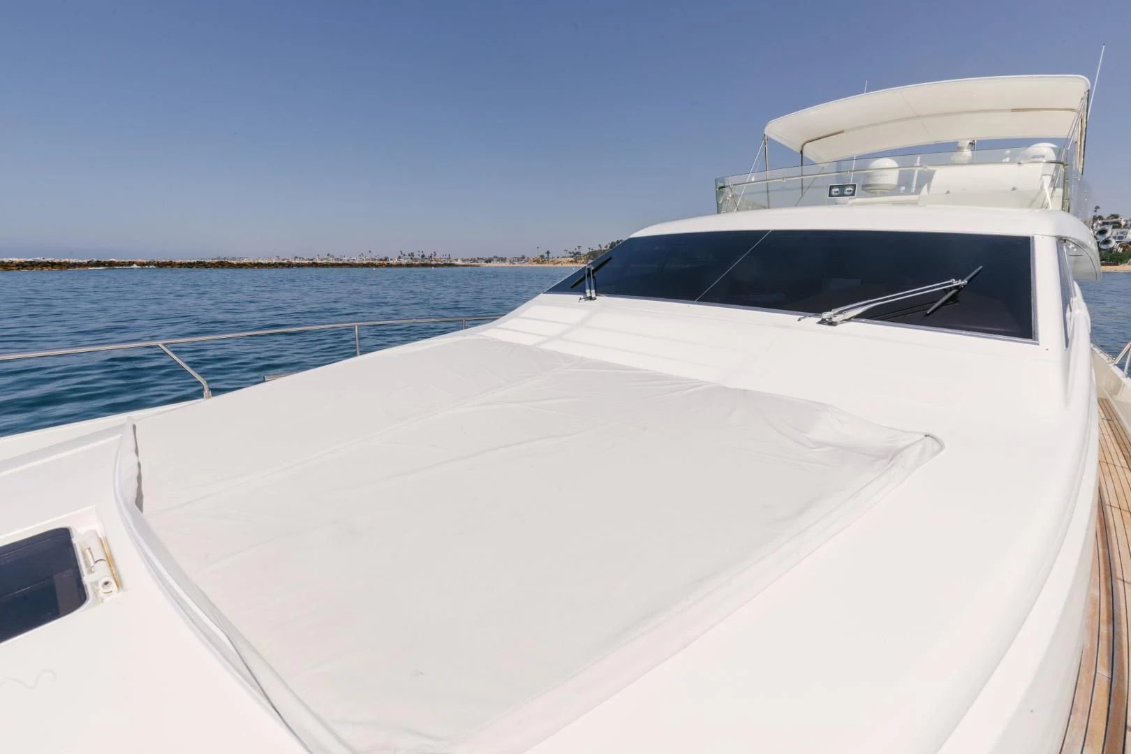 a white boat on a body of water aboard LIVING LIFE Yacht for Sale