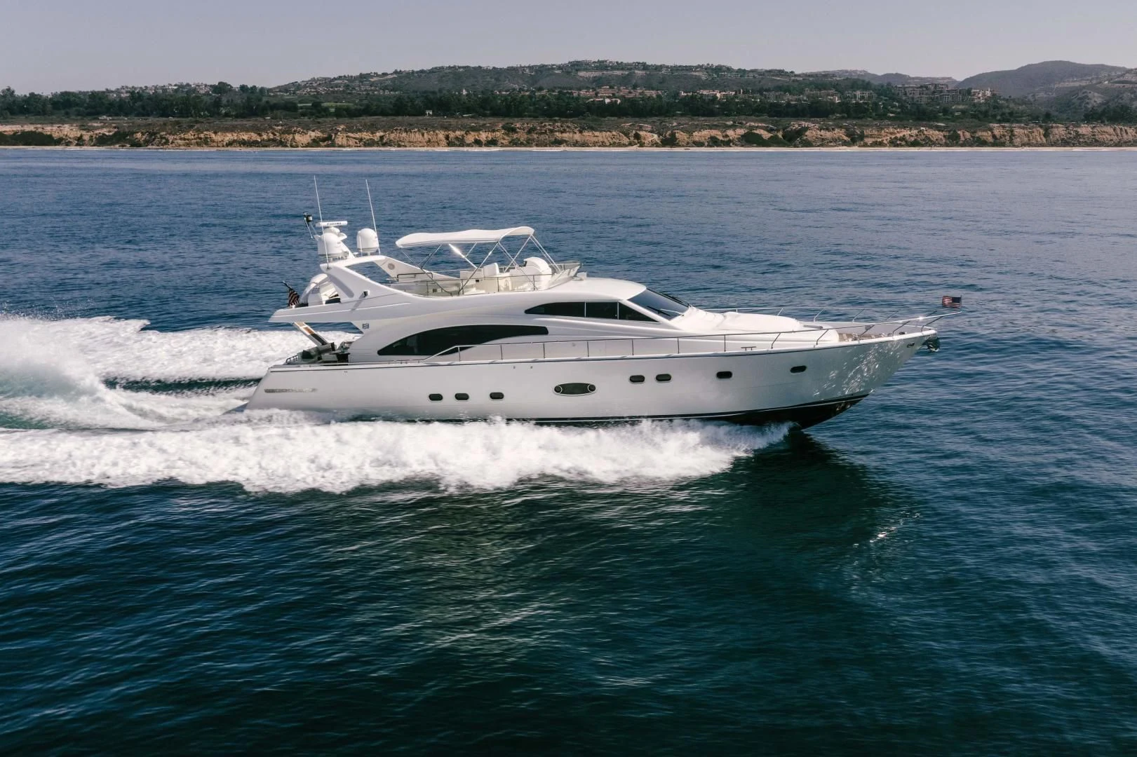 a white yacht on the water aboard LIVING LIFE Yacht for Sale