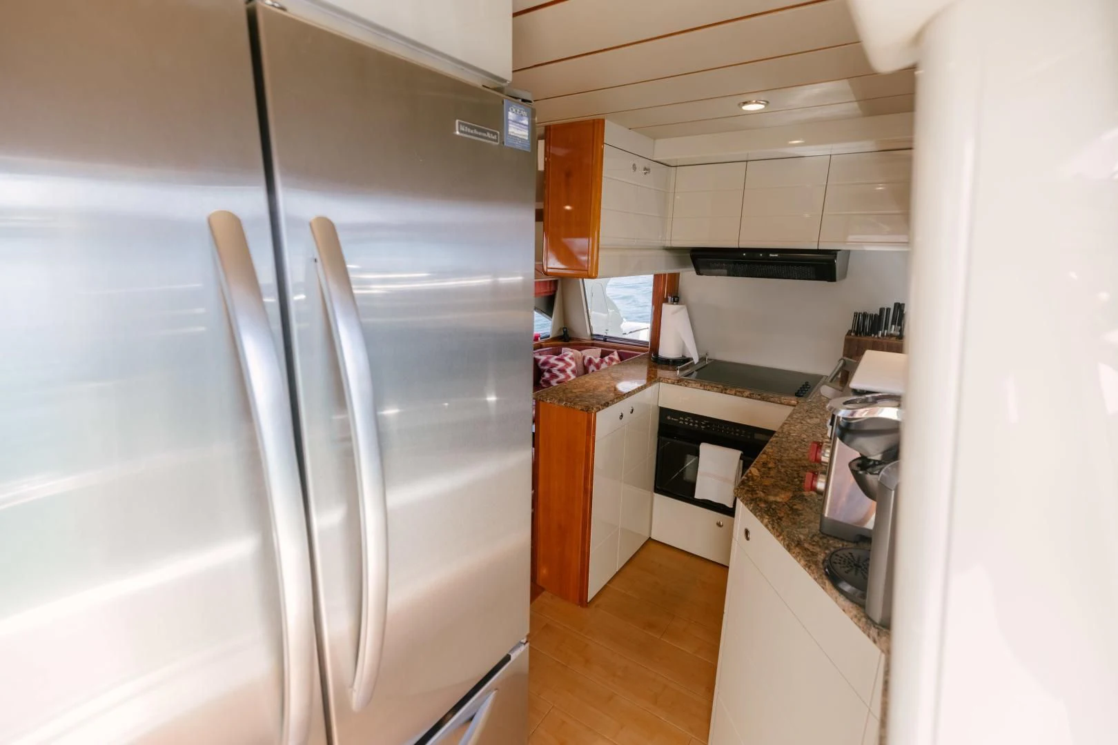 a kitchen with a large refrigerator aboard LIVING LIFE Yacht for Sale