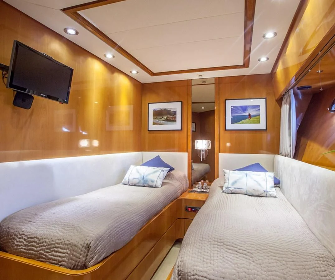 a room with two beds aboard SOLAL Yacht for Sale