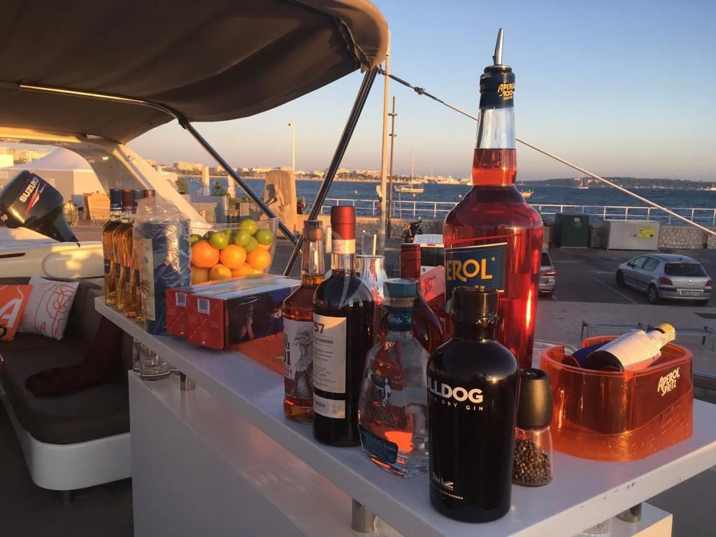 a shelf with bottles of alcohol aboard SOLAL Yacht for Sale