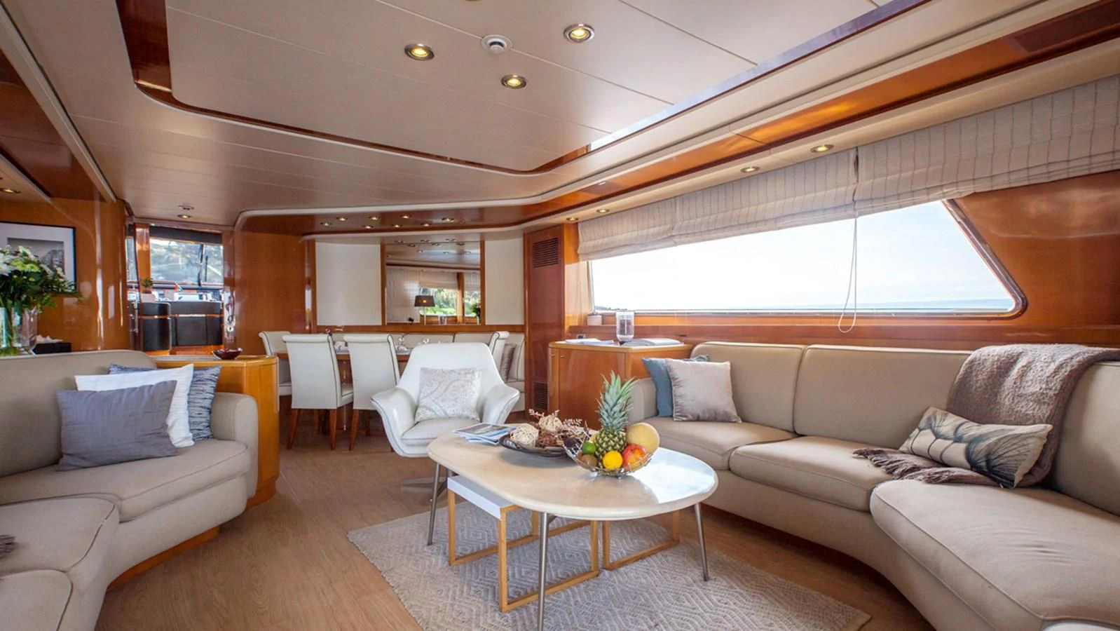 a living room with a couch and a table aboard SOLAL Yacht for Sale