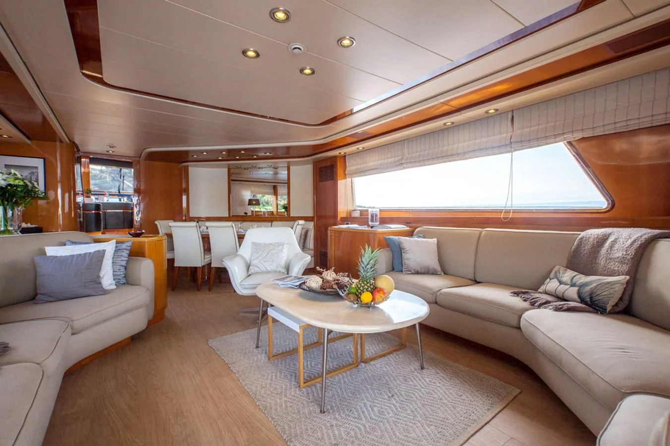 a living room with a couch and a table aboard SOLAL Yacht for Sale