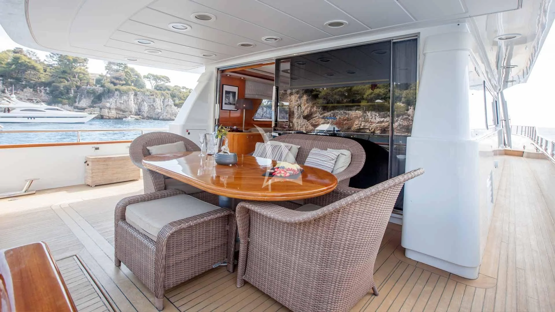 a table and chairs in a room aboard SOLAL Yacht for Sale