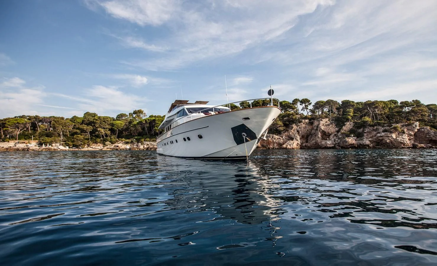 a white boat in the water aboard SOLAL Yacht for Sale