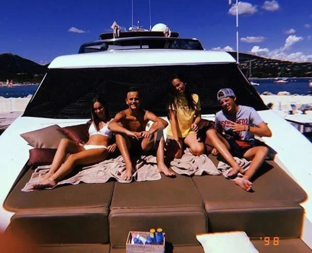 a group of people sitting on a boat aboard SOLAL Yacht for Sale