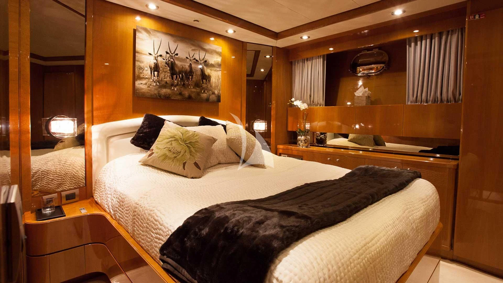 a room with a bed and a mirror aboard SOLAL Yacht for Sale