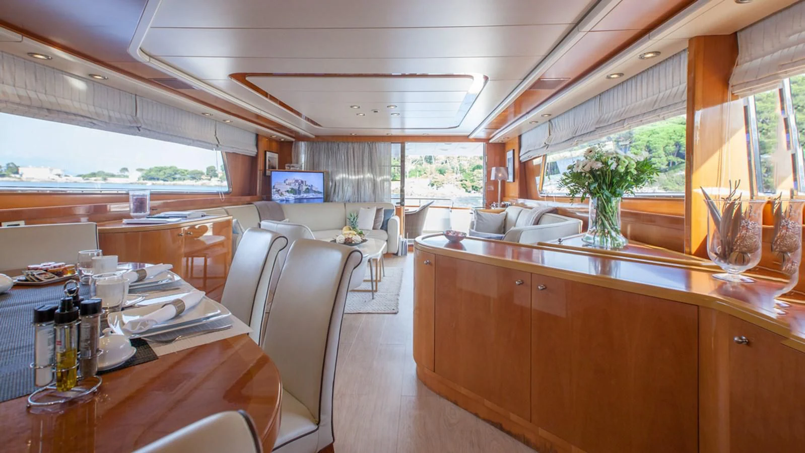 a large kitchen with a table and chairs aboard SOLAL Yacht for Sale