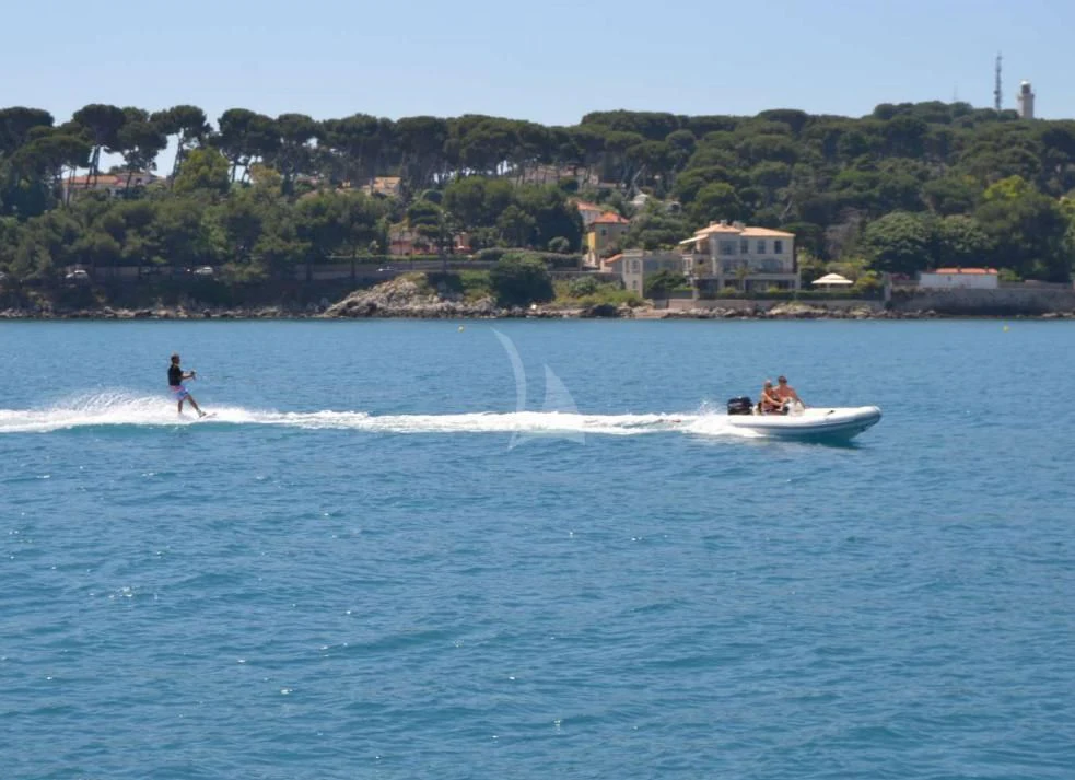 a couple of people water skiing aboard SOLAL Yacht for Sale