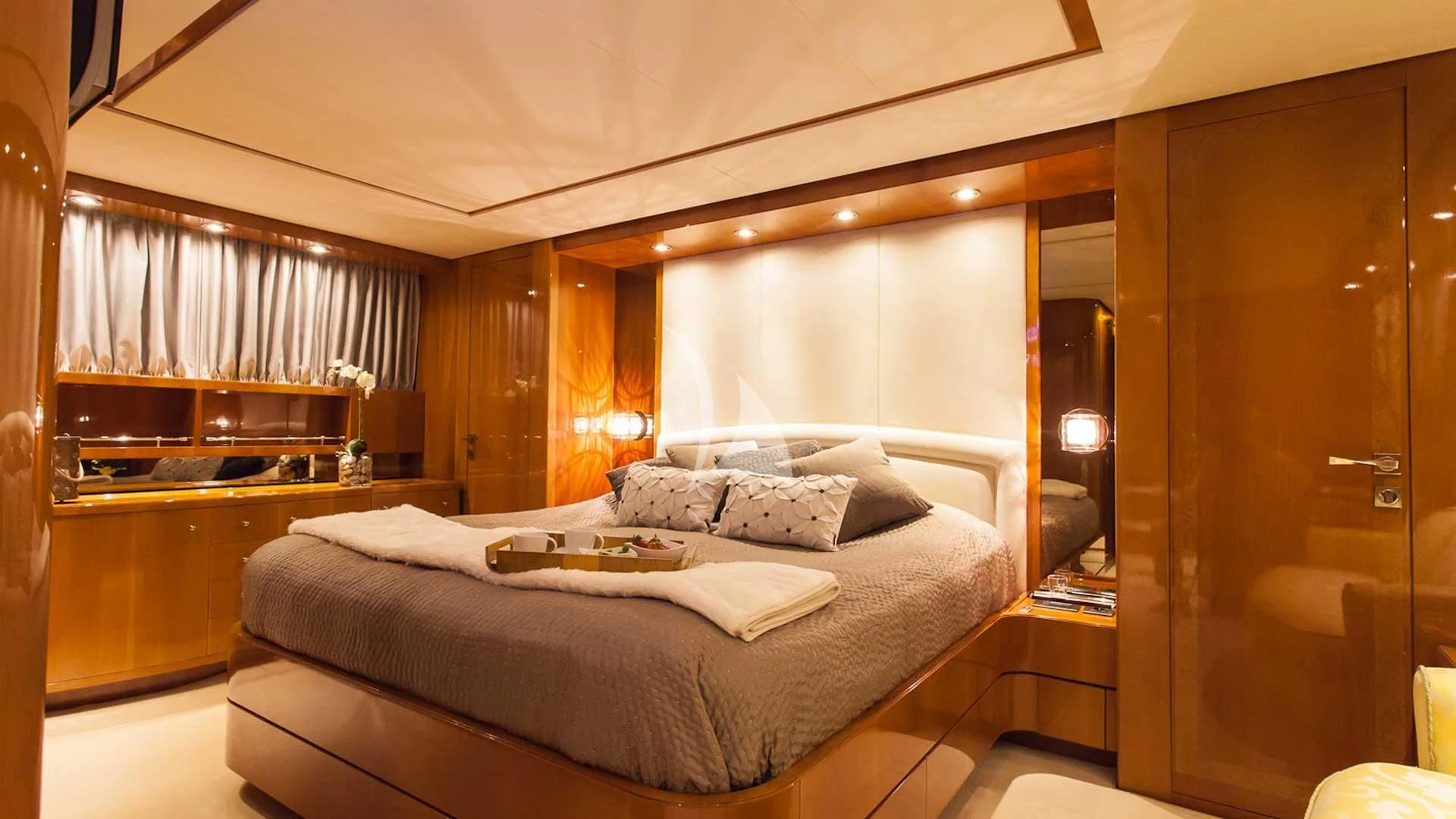 a bedroom with a bed and a closet aboard SOLAL Yacht for Sale