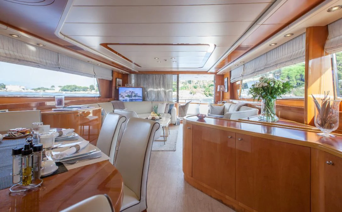 a large kitchen with a table and chairs aboard SOLAL Yacht for Sale