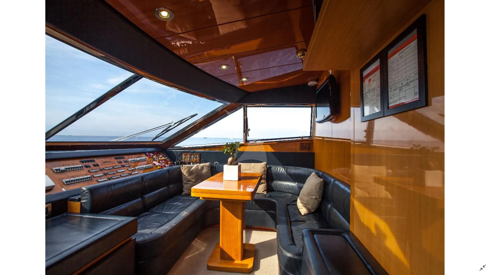 a room with a couch and a table aboard SOLAL Yacht for Sale