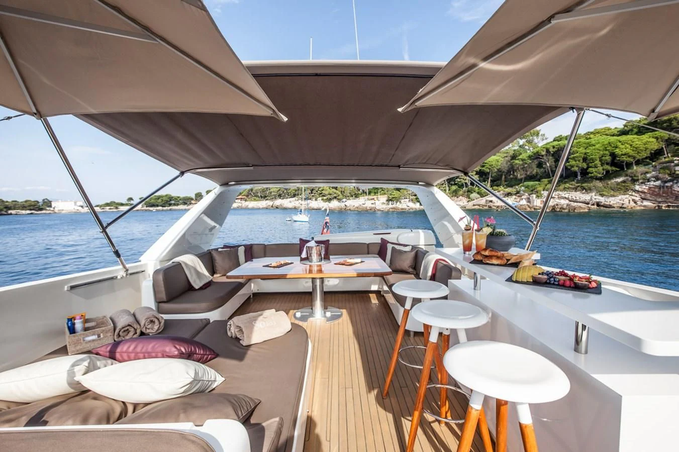 a boat with a table and chairs on the deck aboard SOLAL Yacht for Sale